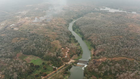 Traveling-down-over-a-river,-dam-on-a-river-in-Angola,-Africa-1