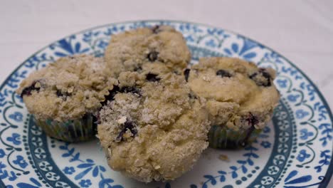 Close-up-of-a-plate-of-homemade-blueberry-muffins---parallax-motion