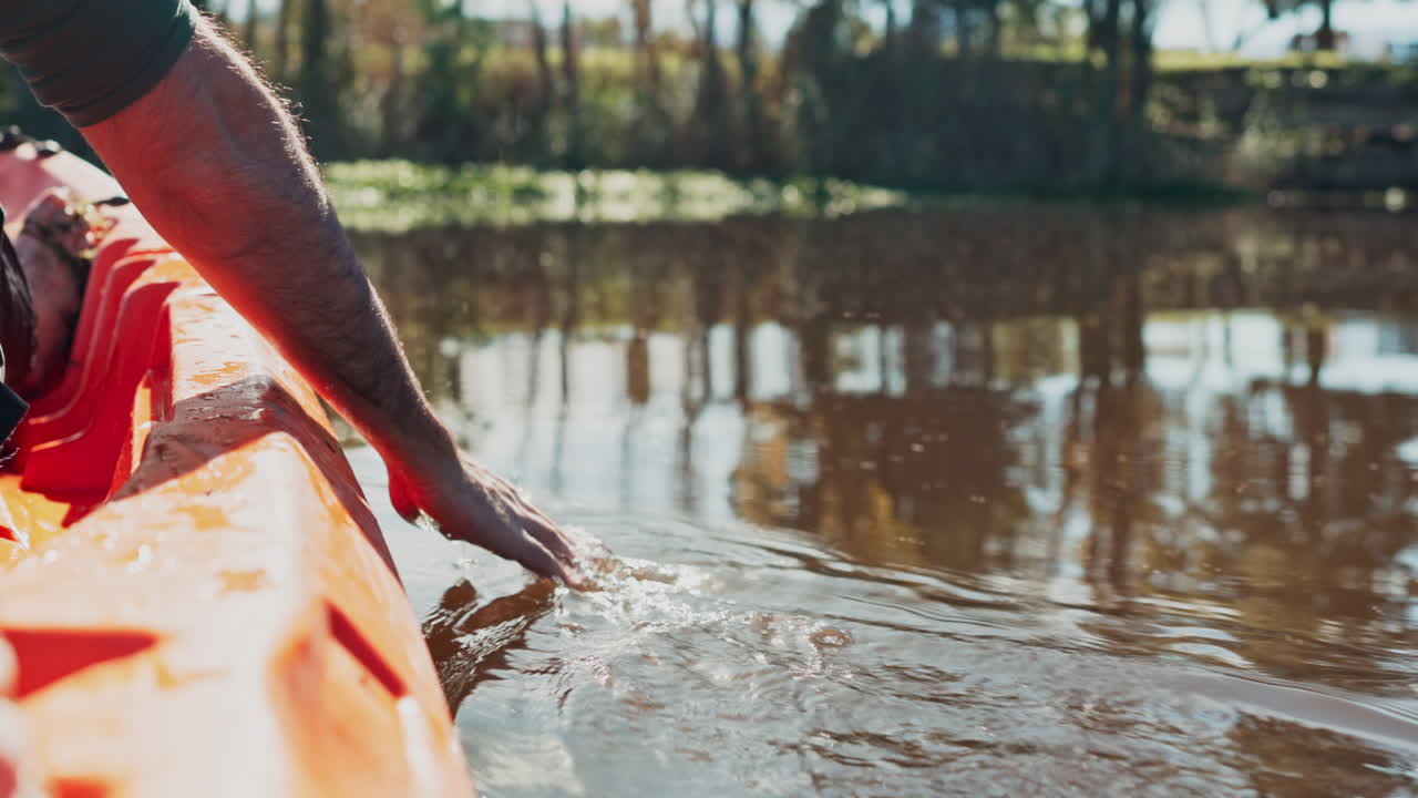 Camping, lake and hand of man in kayak for sports