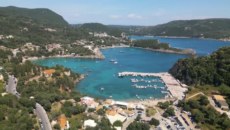 Ascending-Shot-Reveals-Popular-Tourist-Destination-of-Paleokastritsa-Beach-in-Corfu,-Greece