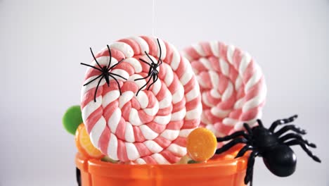 Halloween-bucket-filled-up-with-lollipop-4k