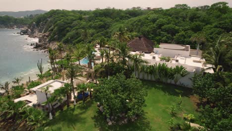 Aerial-over-picturesque-seascape-along-the-mesmerizing-coastline-in-Huatulco,-Mexico