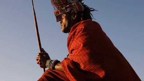 tribal man relaxing on a rock 4k