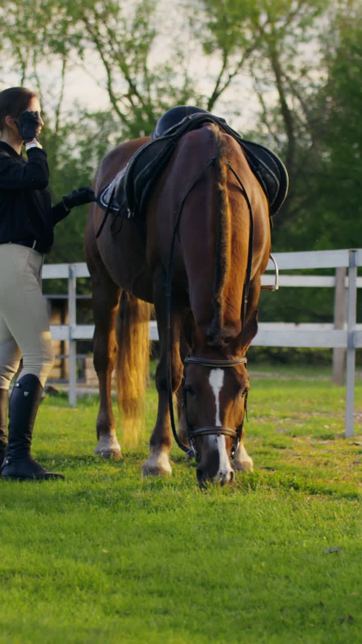 Woman with horse in pasture