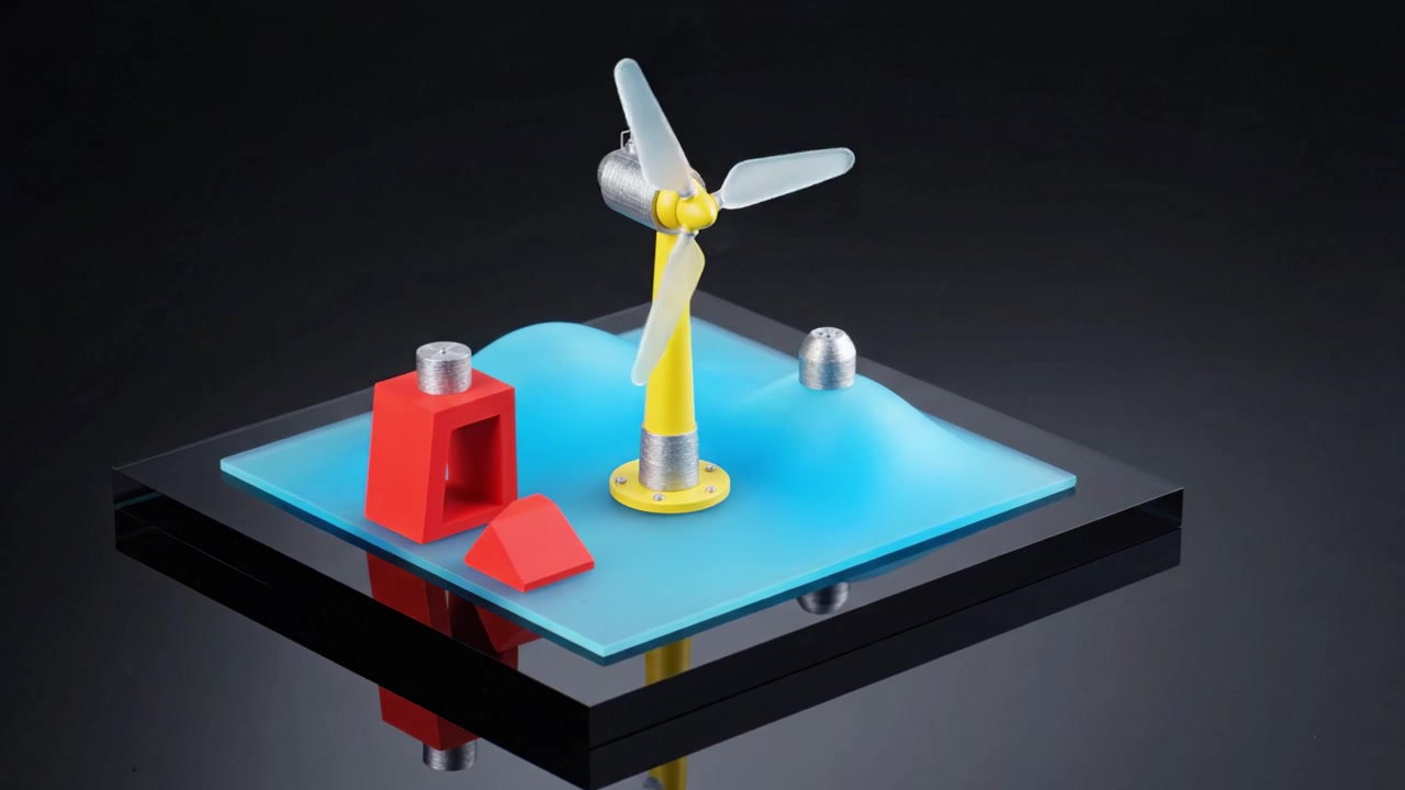 Un modello creativo che mostra una turbina eolica e forme geometriche su una base colorata per arti visive e scopi educativi.