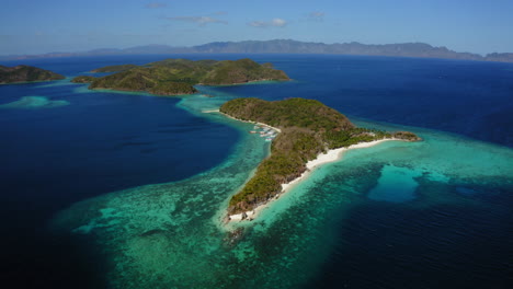 Aerial-view-of-Malcapuya-Beach-island-in-a-sunny-day,-Coron,-Palawan,-Philippines