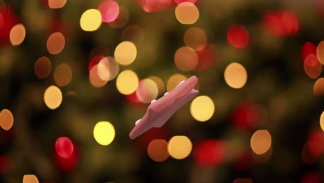 Animación-De-Galleta-De-Jengibre-Con-Forma-De-Estrella-Navideña-Sobre-Luces-Navideñas-Parpadeantes