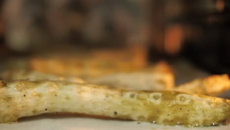 close up on asparagus baking in oven