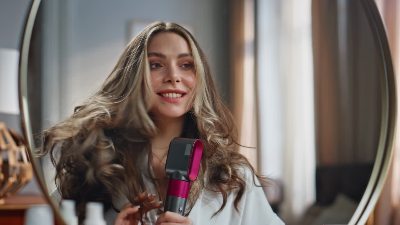 Woman styling hair with a hair dryer