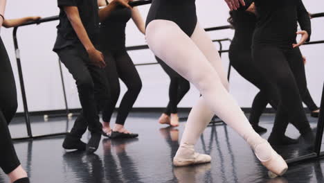 Close-Up-Of--Students-Feet-As-They-Rehearse-Ballet-In-Dance-Studio-At-Performing-Arts-School