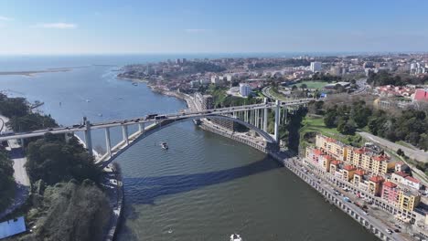 arrabida bridge at porto in district of porto portugal. coastal road. freeway road landscape. downtown cityscape. arrabida bridge in portugal. portugal skyline. travel landscape