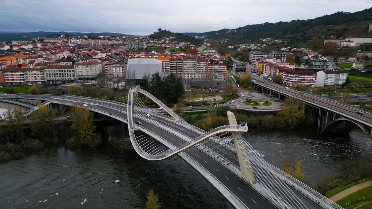 Millennium Bridge Mi&ntilde;o River in Ourense, Galicia, Spain, aerial parallax around unique pathway
