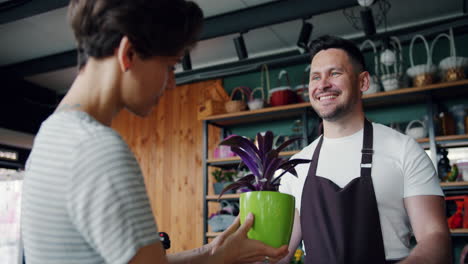 customer interacting with a florist in a shop