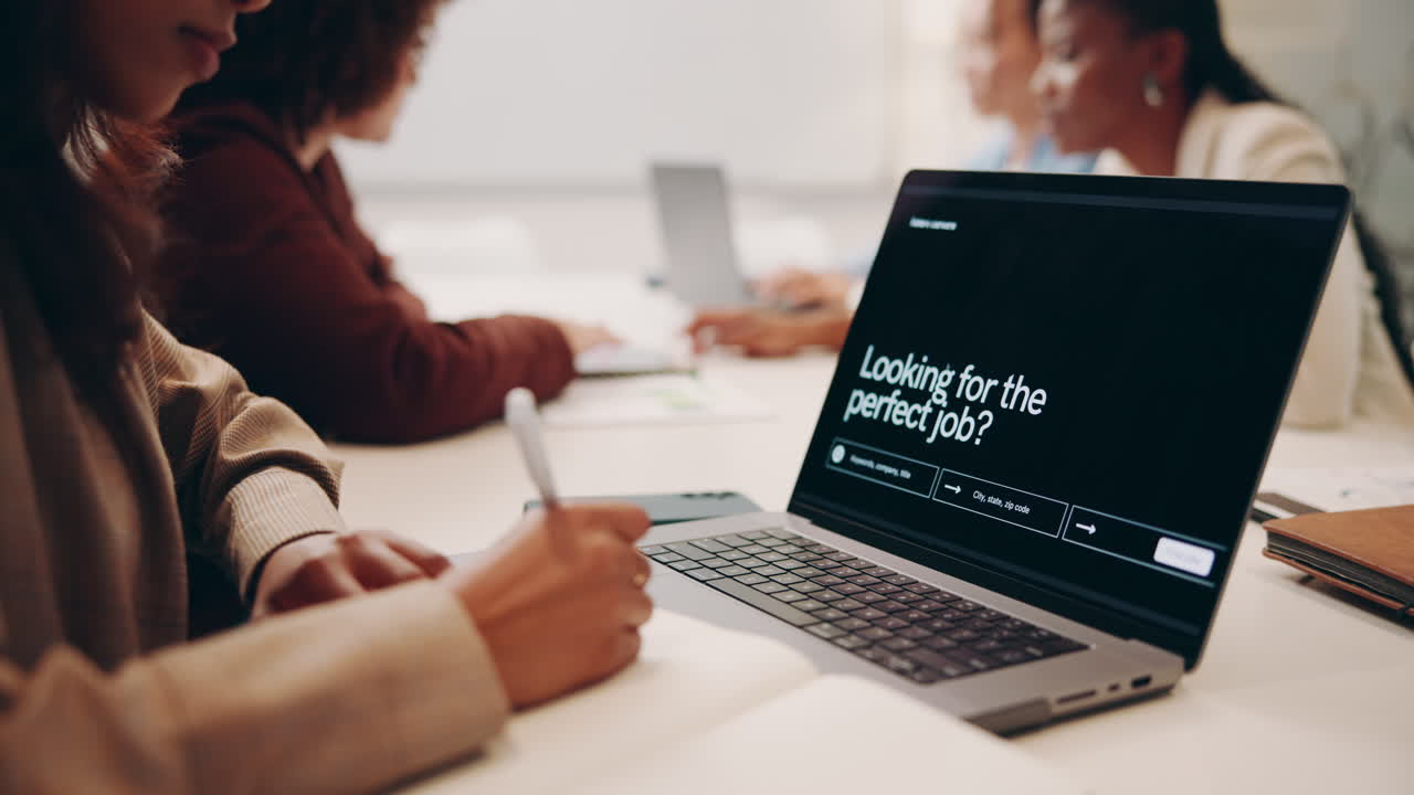 Business Meeting with People Working on Laptops