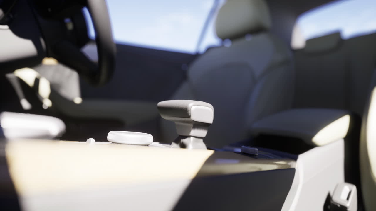 Close up view of modern car interior showcasing gear shift and controls