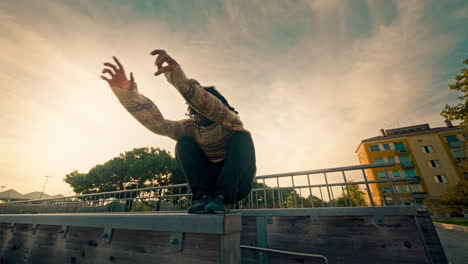 Man performing Parkour jumps in an urban park
