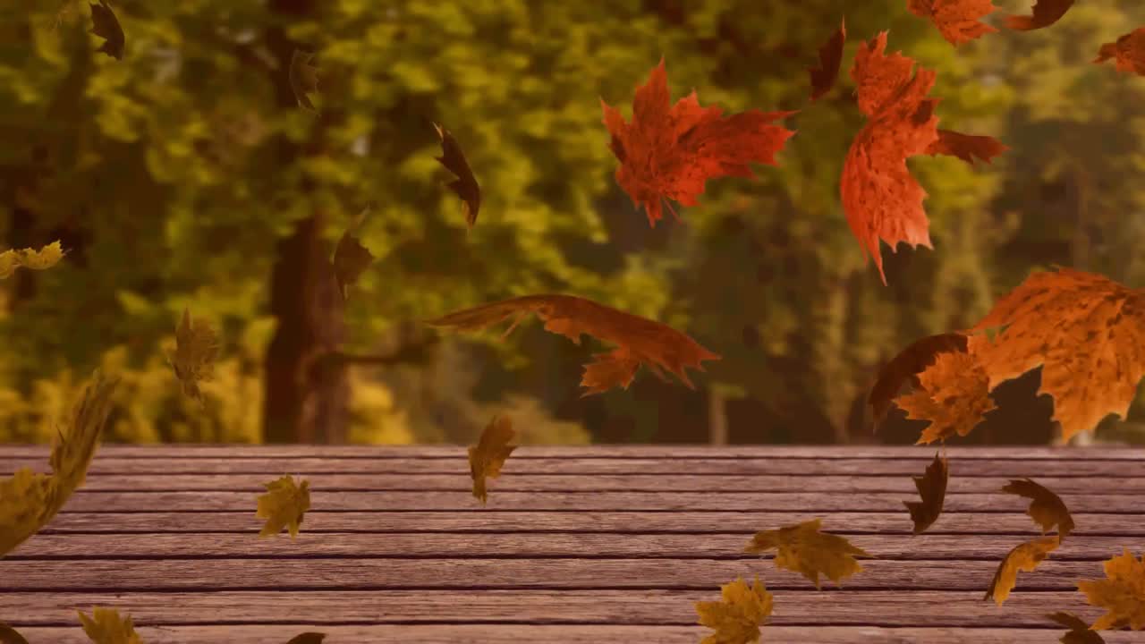 숲을 배경으로 나무 표면 위에 떠다니는 여러 개의 가을 잎의 디지털 애니메이션
