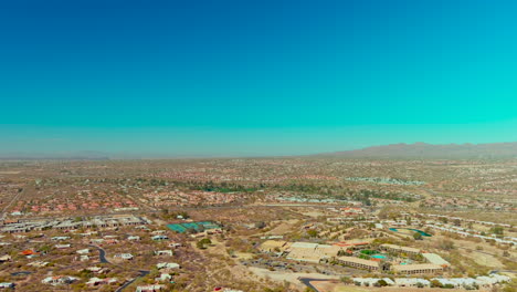 cinematic wide drone shot of homes and highways in tucson arizona