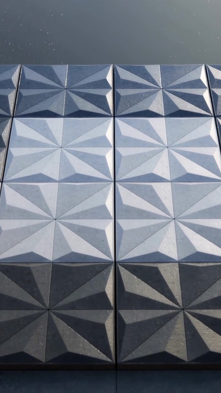 Vertical video: Tilting camera framing starburst panels on facade, showing top band, seams and dust