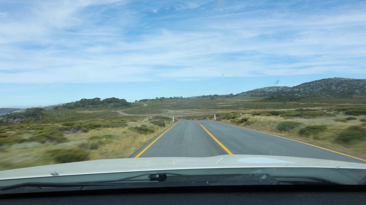 Point of view shot driving over the bogong high plains in Victoria Australia.