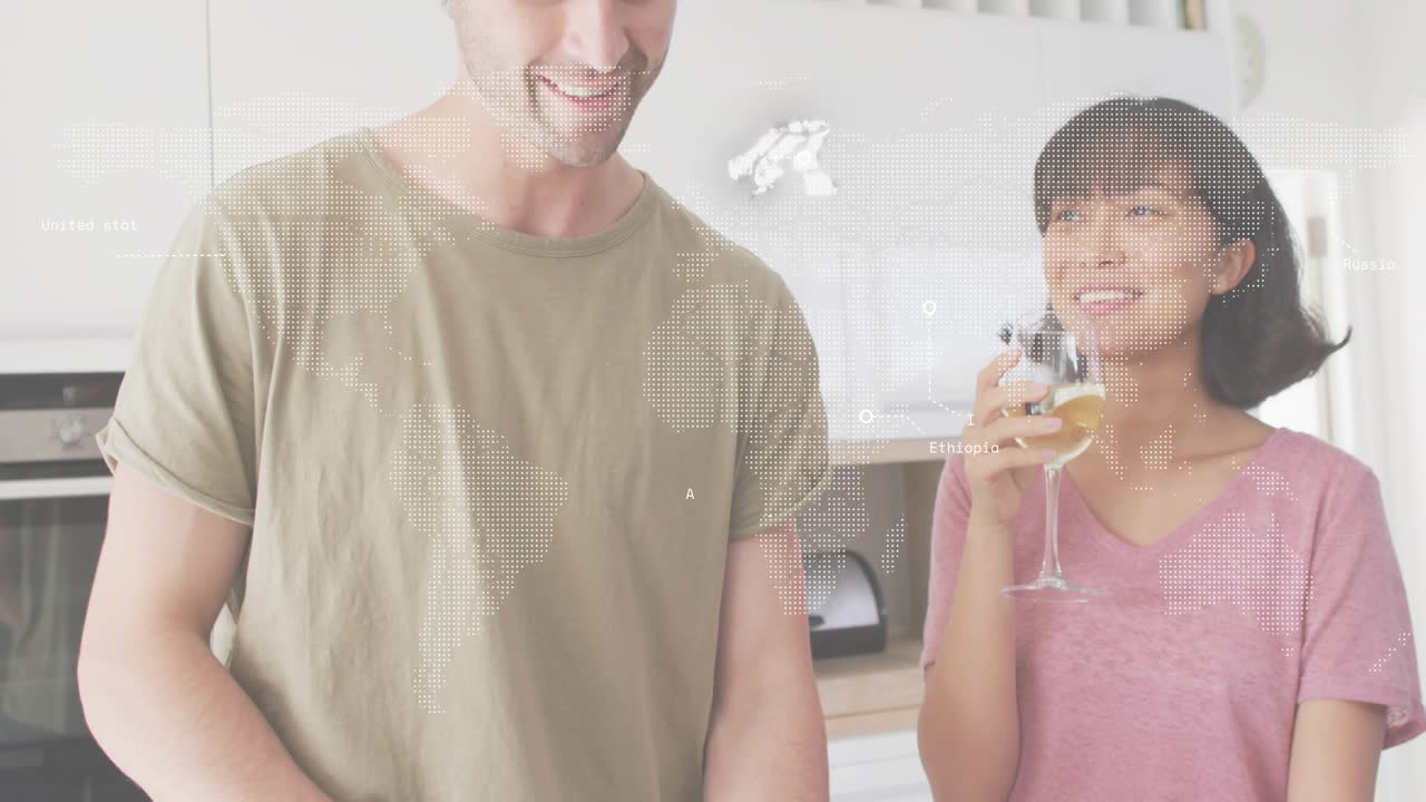 Man chopping pepper initiating map overlay, woman arranging vegetables sipping wine prepping food