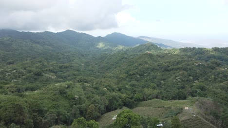 Drone-flies-high-above-the-green-mountains-of-the-Sierra-Nevada,-Colombia