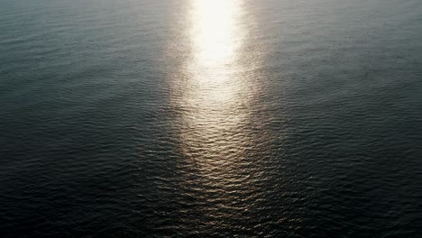 sunlit waters of open sea at dusk in monterrico beach in santa rosa, guatemala