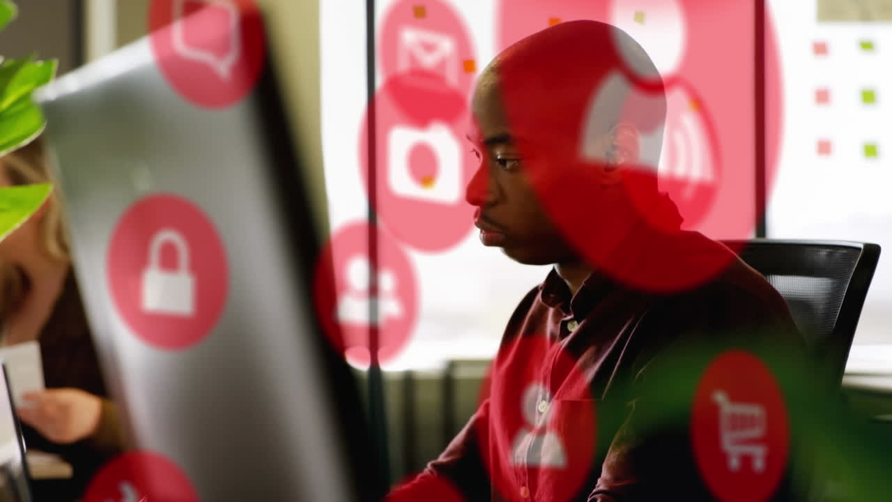 animación de una red de iconos digitales sobre un hombre de negocios usando una computadora