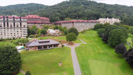 4k drone video of convention center, spa and golf course at historic grove park inn in asheville, nc on sunny summer day-1