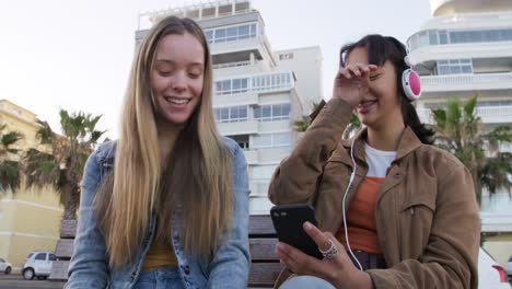 front view of a caucasian and a mixed race girl enjoying time outside