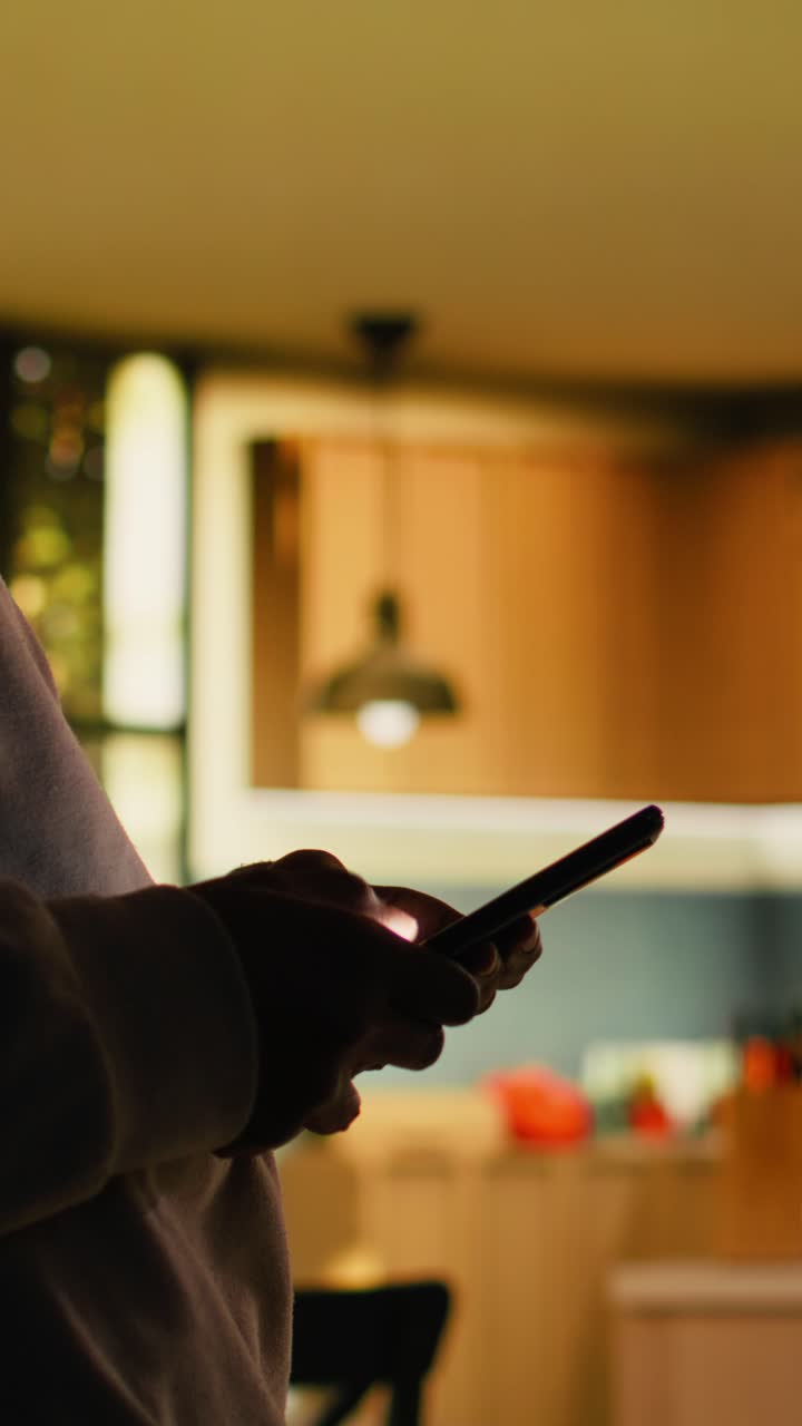 Vertical Video Adult black woman enjoying cozy moment at home and browsing apps