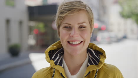 portrait-of-attractive-blonde-woman-laughing-happy-enjoying-successful-urban-lifestyle-cheerful-caucasian-female-commuter-in-city-street-slow-motion