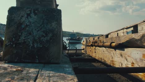 Traditional-Greek-carvel-built-fishing-boat-wooden-slip-way-in-foreground