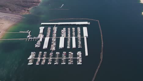 A-high-flying-drone-shot-over-Lake-Mead,-a-massive-reservoir-formed-by-the-Hoover-Dam-on-the-Colorado-River,-that-lies-on-the-border-of-Arizona-and-Nevada,-just-east-of-Las-Vegas