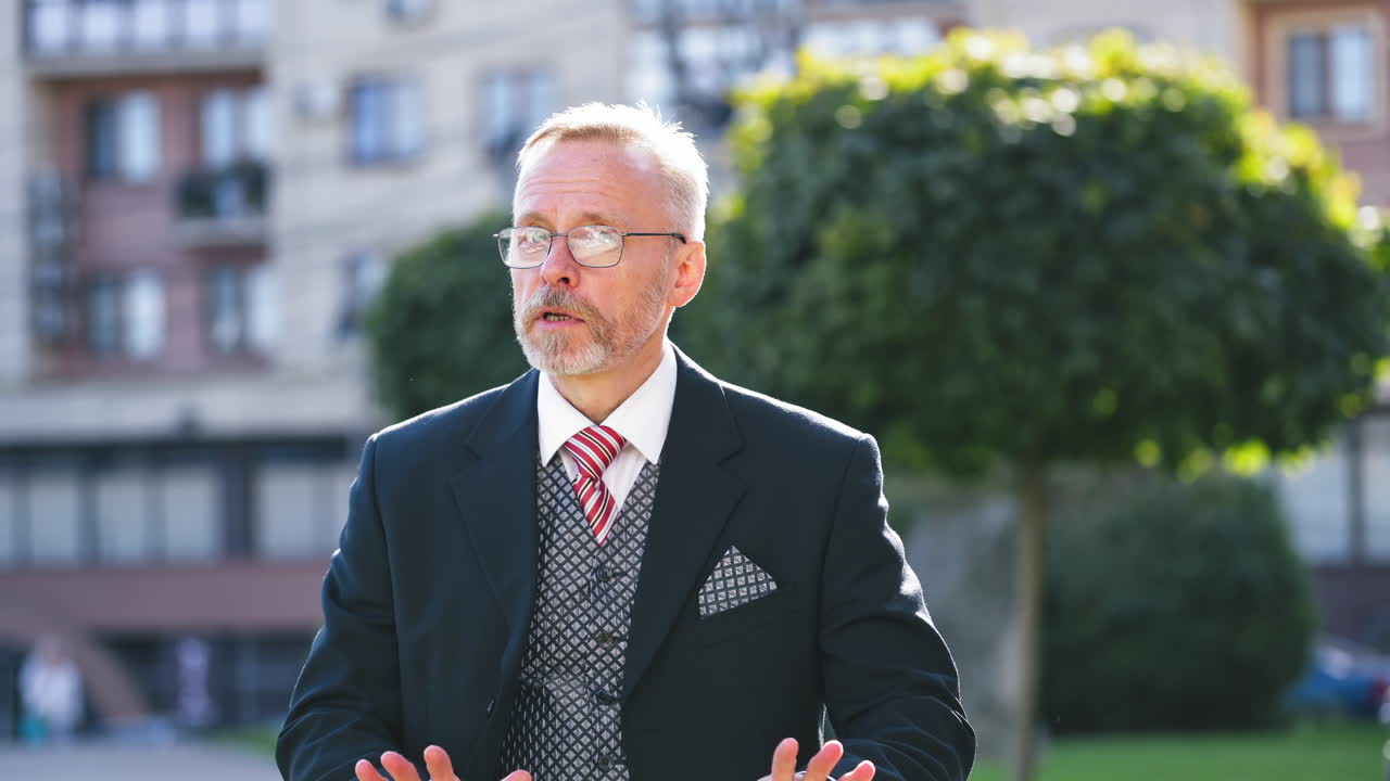 Reporter working on street. Successful handsome male reporter working on street
