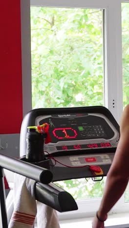 A Woman in Red Sportswear Walks on a Treadmill in the Gym Healthy Lifestyle a Woman in Red Sportswear Walks on a Treadmill in the Gym Healthy Lifestyle