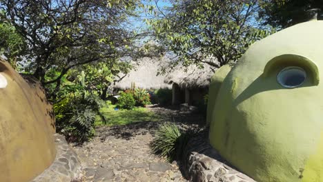 peaceful cob house with thatched roof in lush garden