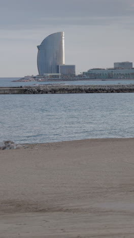 barcelona beaches almost empty during the coronavirus lockdown in vertical