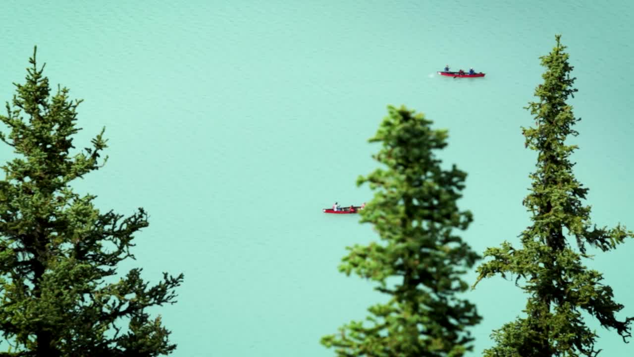 People canoeing on Lake Louise with high powered zoom lens.