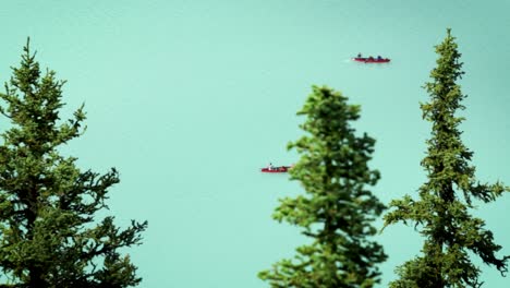 people canoeing on lake louise with high powered zoom lens.