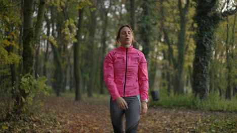 woman exercising in an autumn park