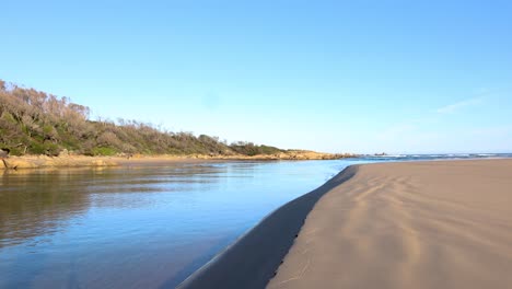 a beautiful calm estuary in a remote beach in gippsland victoria