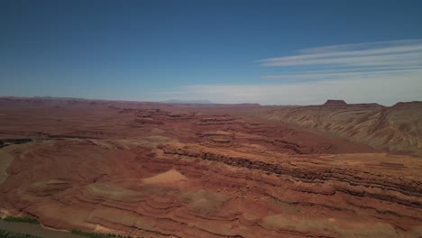 Drone-Aerial-Cinematic-Shot-of-a-stunning-scenery-of-Antelope-National-Park-in-Arizona,-is-characterized-by-the-unique-textures-of-its-rock-formations,-a-meandering-river-alongside