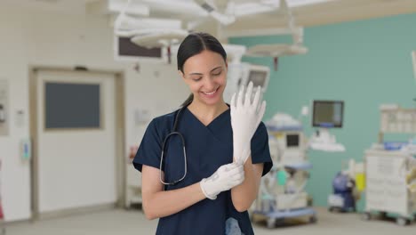 Happy-Indian-female-doctor-getting-ready-for-operation