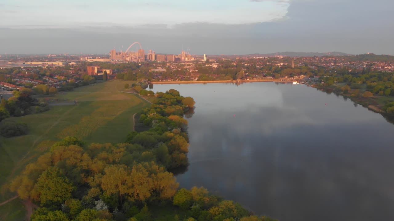 Flyover Brent Reservoir Park toward Wembley Stadium - Aerial, Dolly In