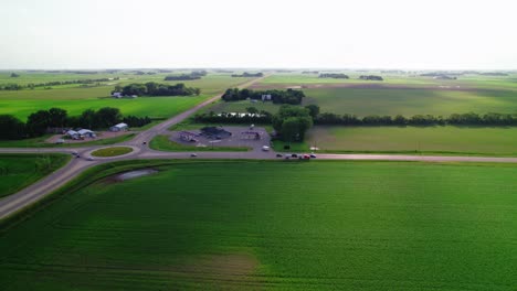 aerial view of a circular road intersection in minnesota, usa, featuring a tanker truck navigating the crossing. transportation logistics and the importance of roadway design in freight movement.