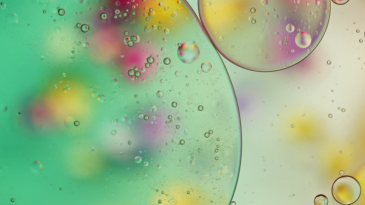Abstract Colorful Food Oil Drops Bubbles and spheres Flowing