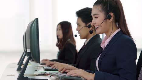 business people wearing headset working in office