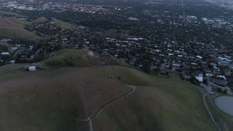 Panning-up-shot-revealing-the-Wasatch-mountain-range-during-sunset-near-downtown-Salt-Lake-City,-Utah