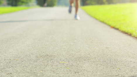 close up runner man feet running outdoors